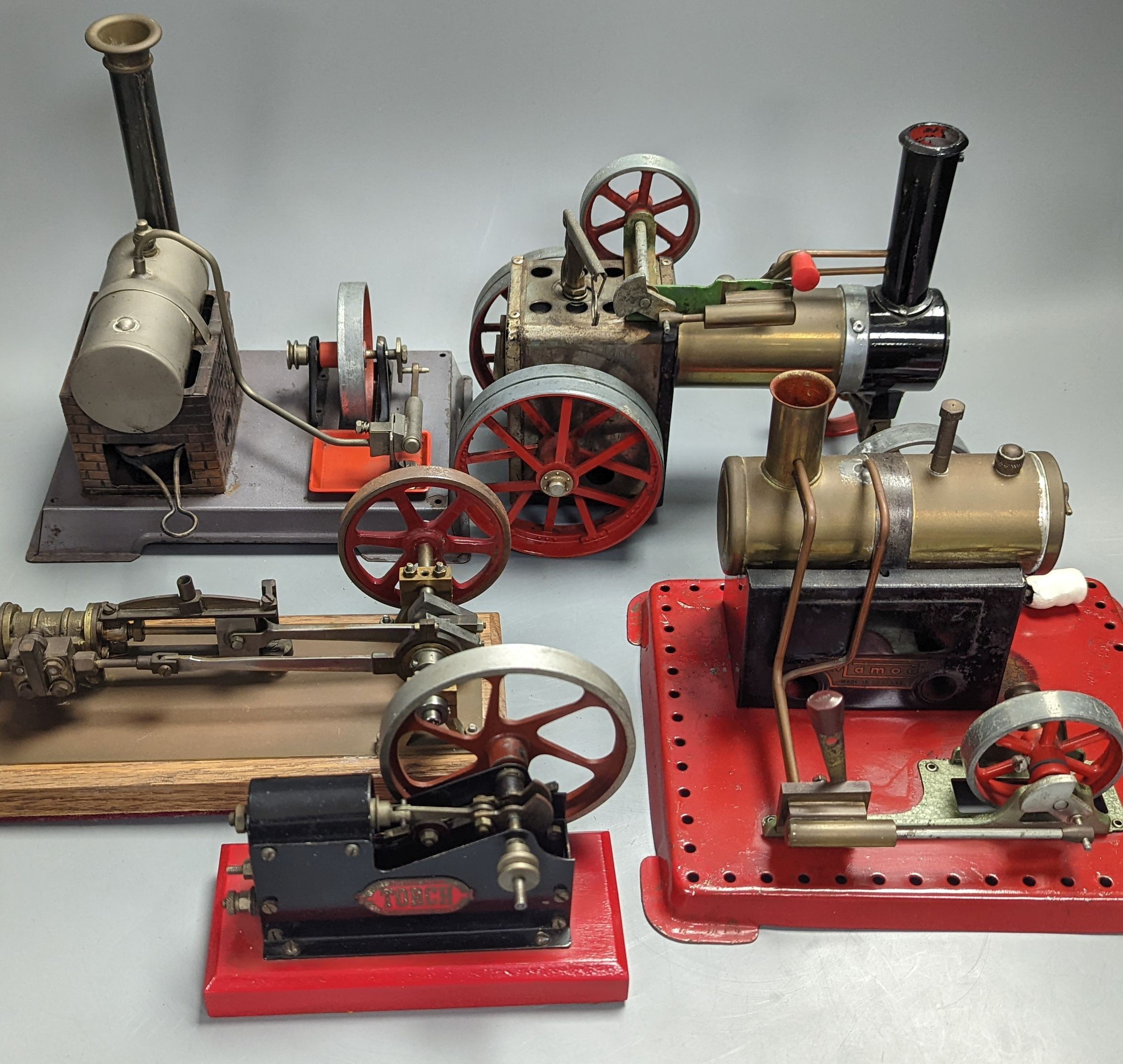 Four horizontal stationary steam engines, including Mamod and Torch and a Mamod steam wagon, 23cm